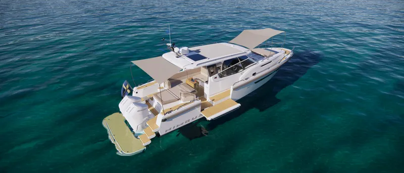 Slide: The Image of 2024 Nimbus W11 yacht cruising on clear blue water. - 16