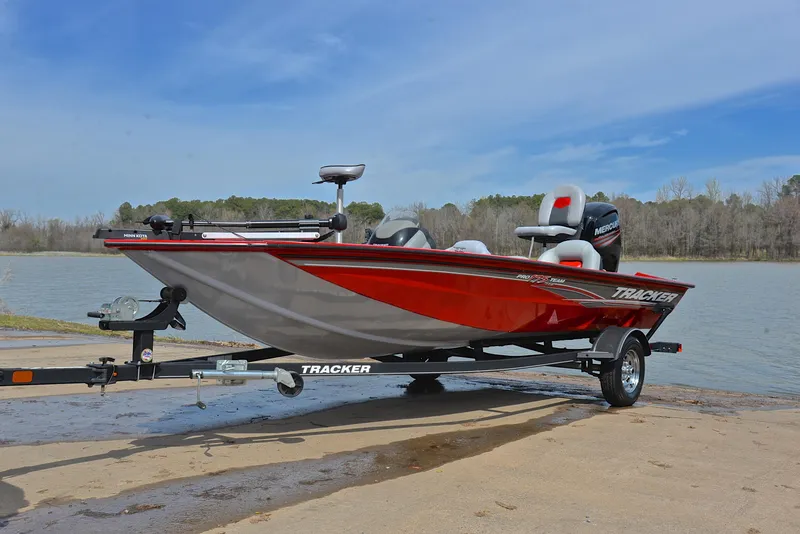 Slide: The Image of 2017 Tracker Pro Team 175 TXW fishing boat on trailer by a lake. - 10