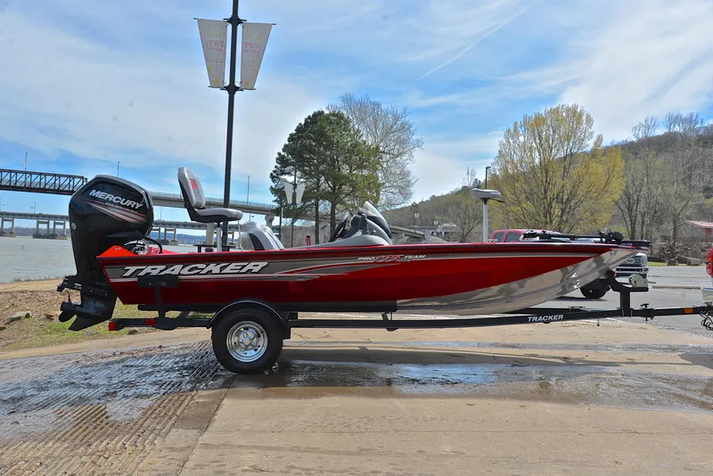 Slide: The Image of 2017 Tracker Pro Team 175 TXW boat on trailer by a lakeside. - 15