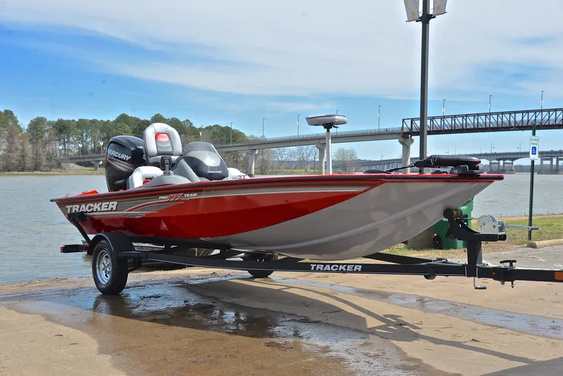 Slide: The Image of 2017 Tracker Pro Team 175 TXW fishing boat on trailer by a lake. - 16