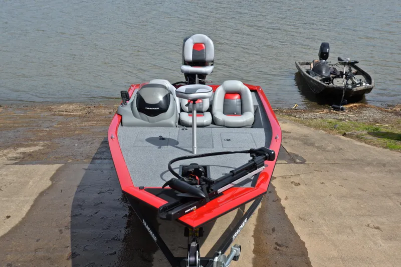 Slide: The Image of 2017 Tracker Pro Team 175 TXW boat at a lakeside ramp. - 17