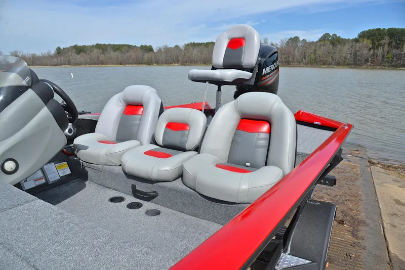 Slide: The Image of 2017 Tracker Pro Team 175 TXW boat with gray and red seating on a lake. - 18