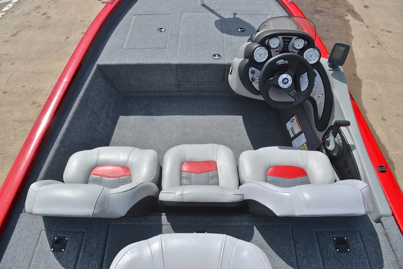 Slide: The Image of 2017 Tracker Pro Team 175 TXW boat interior with steering console and seating. - 20