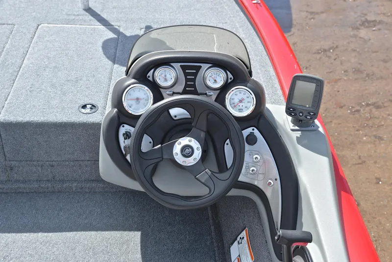 Slide: The Image of 2017 Tracker Pro Team 175 TXW boat dashboard with steering wheel and gauges. - 23