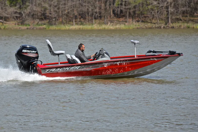 Slide: The Image of 2017 Tracker Pro Team 175 TXW boat cruising on a lake. - 3