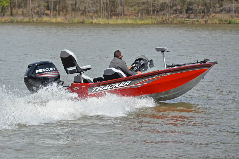 Slide: The Image of 2017 Tracker Pro Team 175 TXW boat speeding on a lake. - 5