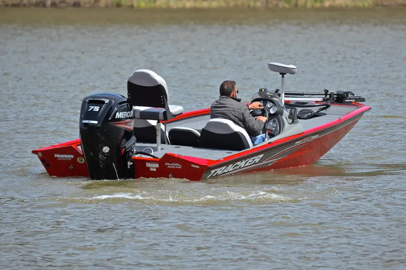 Slide: The Image of 2017 Tracker Pro Team 175 TXW boat on water with Mercury 75 engine. - 8