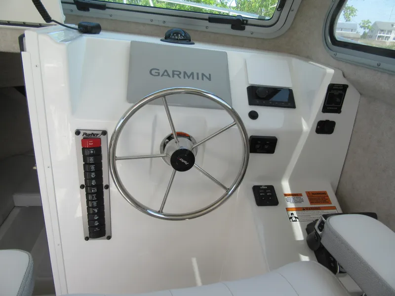 Slide: The Image of 2023 Parker 2520 XLD Sport Cabin helm with Garmin navigation system. - 10