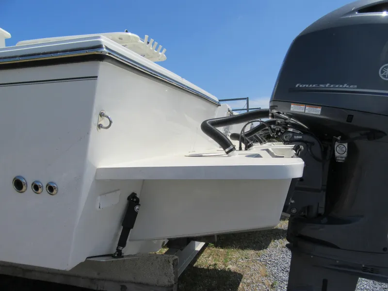 Slide: The Image of 2023 Parker 2520 XLD Sport Cabin boat with outboard motor, rear view. - 3