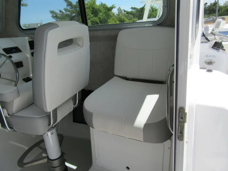 Slide: The Image of 2023 Parker 2520 XLD Sport Cabin interior seating with white upholstery. - 9