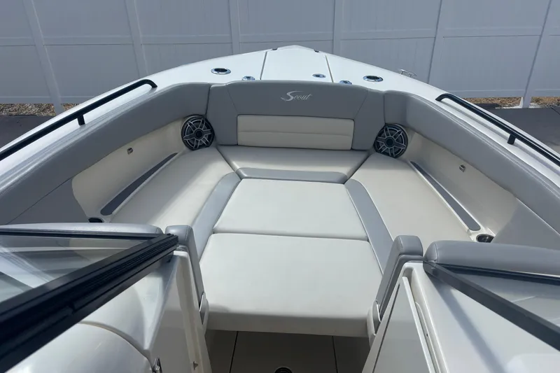 Slide: The Image of 2022 Scout 255 Dorado boat interior with cushioned seating and speakers. - 13