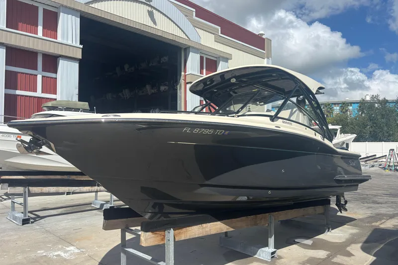 Slide: The Image of 2022 Scout 255 Dorado boat on display outside a storage facility. - 2