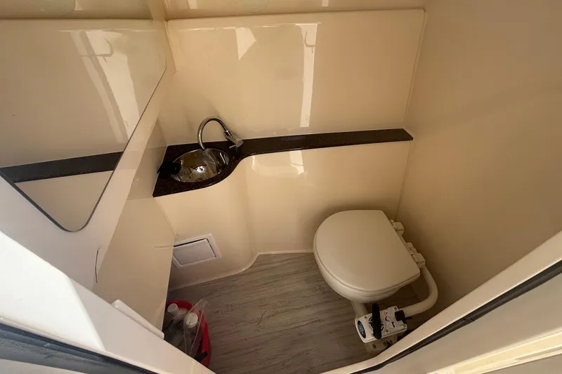 Slide: The Image of 2022 Scout 255 Dorado boat bathroom with sink and toilet. - 20