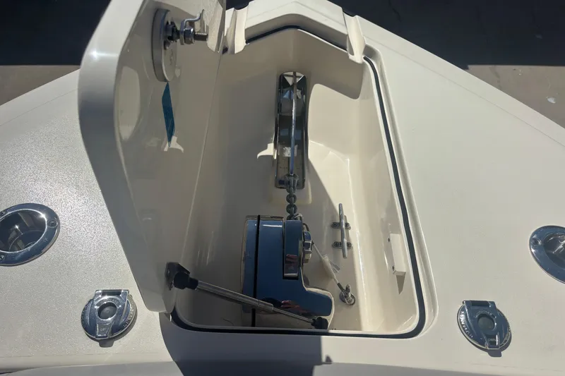 Slide: The Image of 2022 Scout 255 Dorado boat anchor compartment with stainless steel fittings. - 21