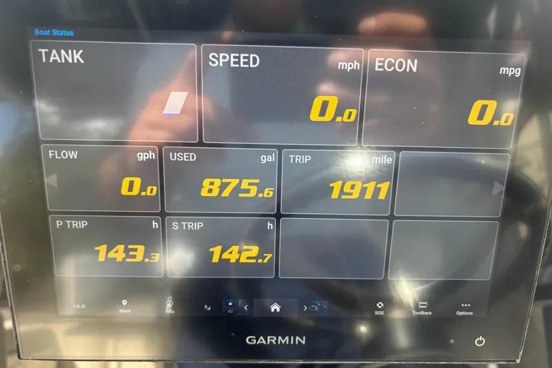 Slide: The Image of Garmin display on 2022 Scout 255 Dorado showing fuel and trip data. - 35