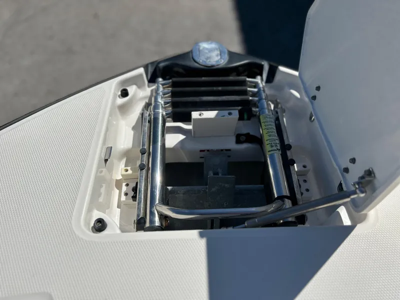 Slide: The Image of 2014 Chaparral Sunesta 244 boat ladder compartment. - 22