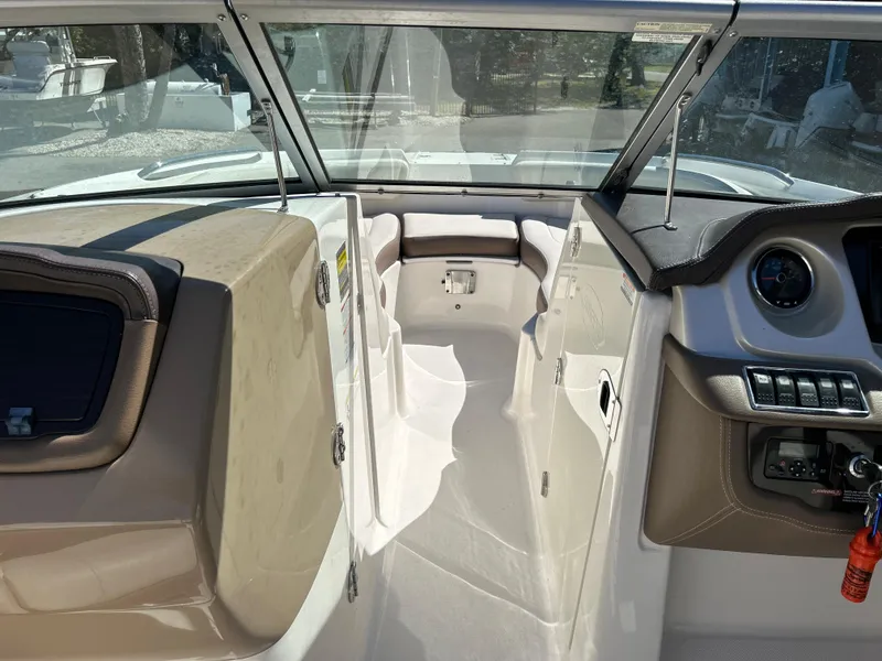 Slide: The Image of 2014 Chaparral Sunesta 244 boat interior with open windshield and seating area. - 27