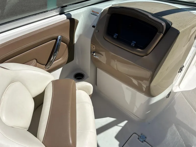 Slide: The Image of 2014 Chaparral Sunesta 244 boat interior with beige and brown seating. - 30