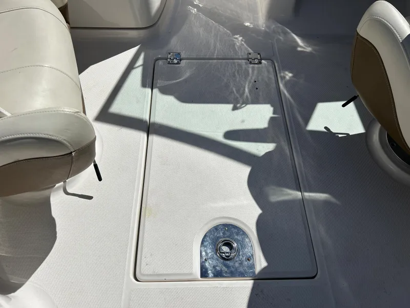 Slide: The Image of 2014 Chaparral Sunesta 244 boat interior with storage compartment. - 40