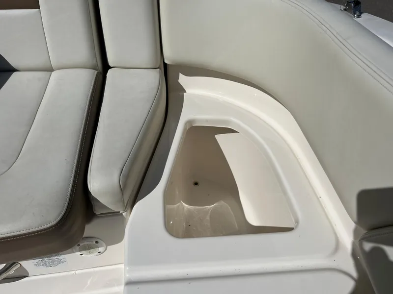 Slide: The Image of 2014 Chaparral Sunesta 244 boat seating and storage compartment. - 44