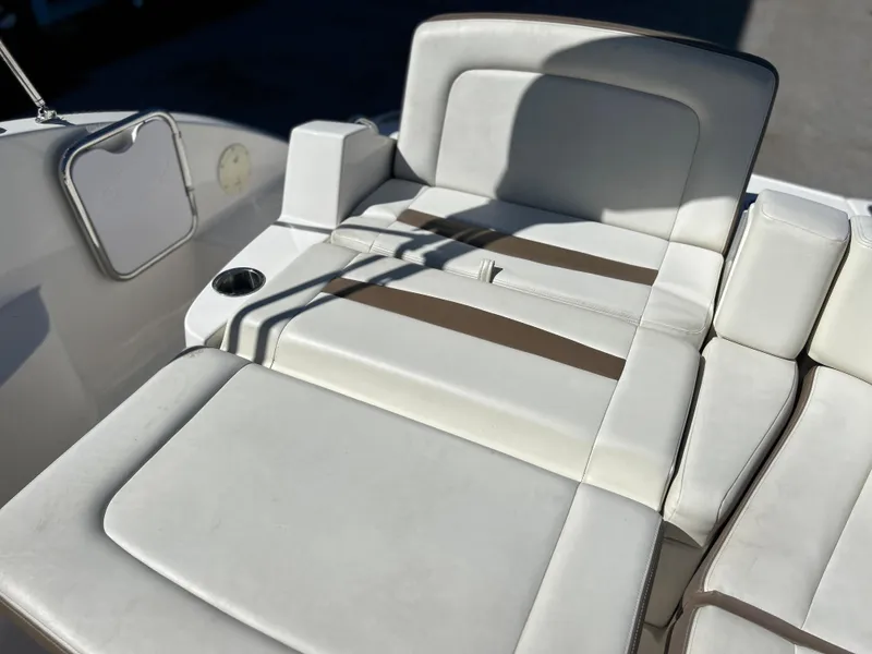 Slide: The Image of 2014 Chaparral Sunesta 244 boat interior seating with cup holder. - 46