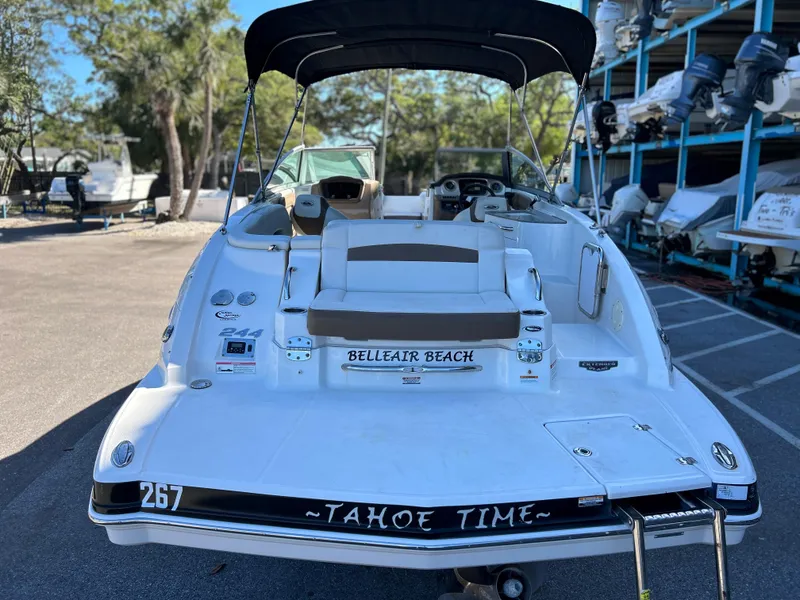 Slide: The Image of 2014 Chaparral Sunesta 244 boat docked at marina, rear view. - 6