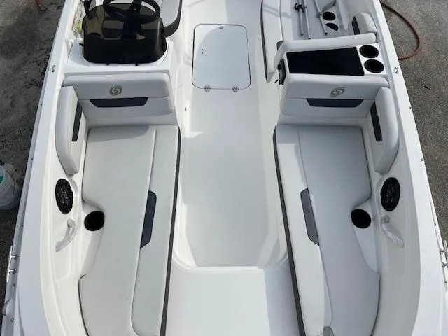 Slide: The Image of 2020 Hurricane SunDeck Sport 185 OB boat interior with seating and storage compartments. - 10