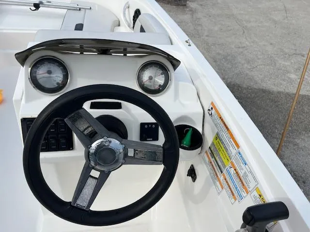 Slide: The Image of Steering console of 2020 Hurricane SunDeck Sport 185 OB boat with gauges and controls. - 5