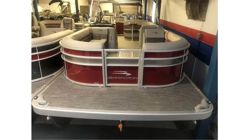 Slide: The Image of 2023 Bennington 24SXL pontoon boat in showroom. - 0