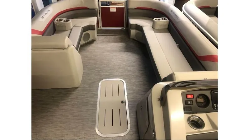 Slide: The Image of 2023 Bennington 24SXL pontoon boat interior with gray and red seating. - 11