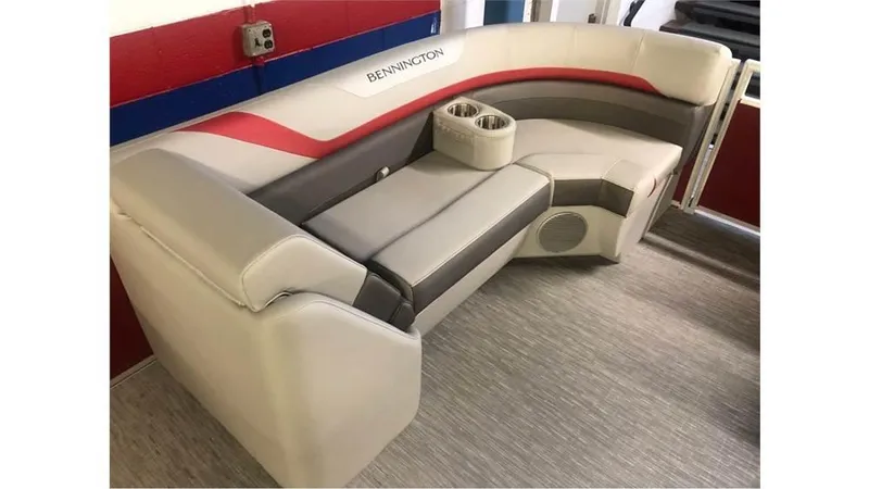 Slide: The Image of 2023 Bennington 24SXL boat interior seating with cup holders. - 12