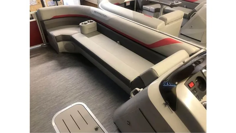 Slide: The Image of 2023 Bennington 24SXL pontoon boat interior with plush seating and modern design. - 13