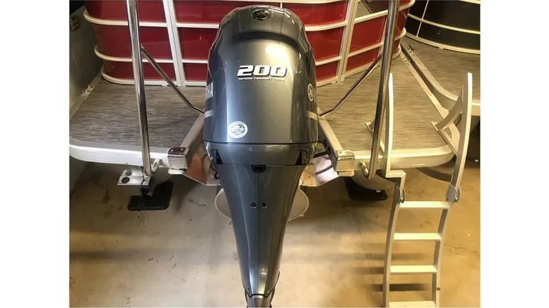 Slide: The Image of 2023 Bennington 24SXL pontoon boat with a 200 horsepower outboard motor. - 3