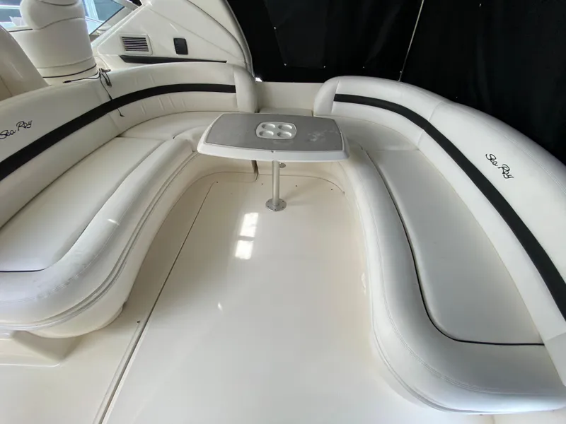 Slide: The Image of 2006 Sea Ray Sundancer 44 interior seating area with table. - 10