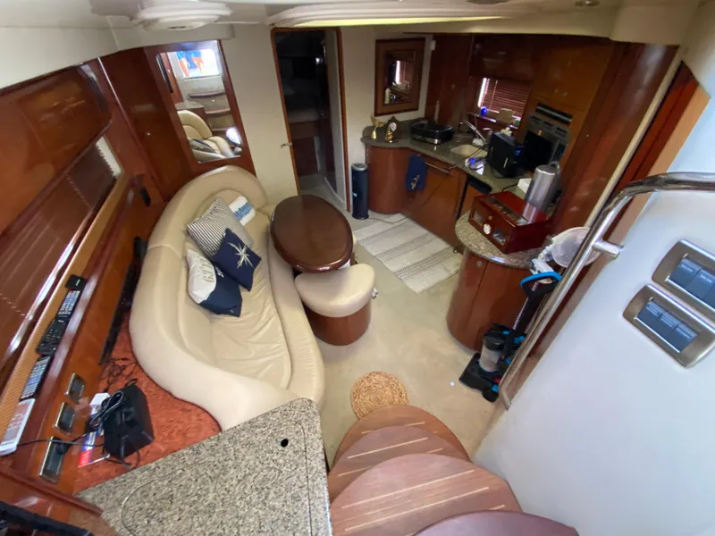 Slide: The Image of Interior of 2006 Sea Ray Sundancer 44 yacht with kitchen and seating area. - 19