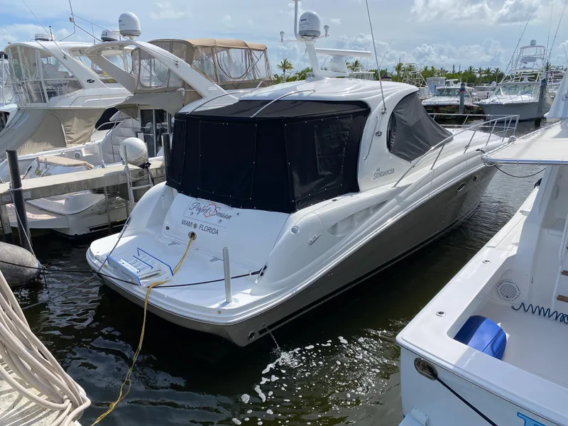 Slide: The Image of 2006 Sea Ray Sundancer 44 yacht docked at marina. - 2