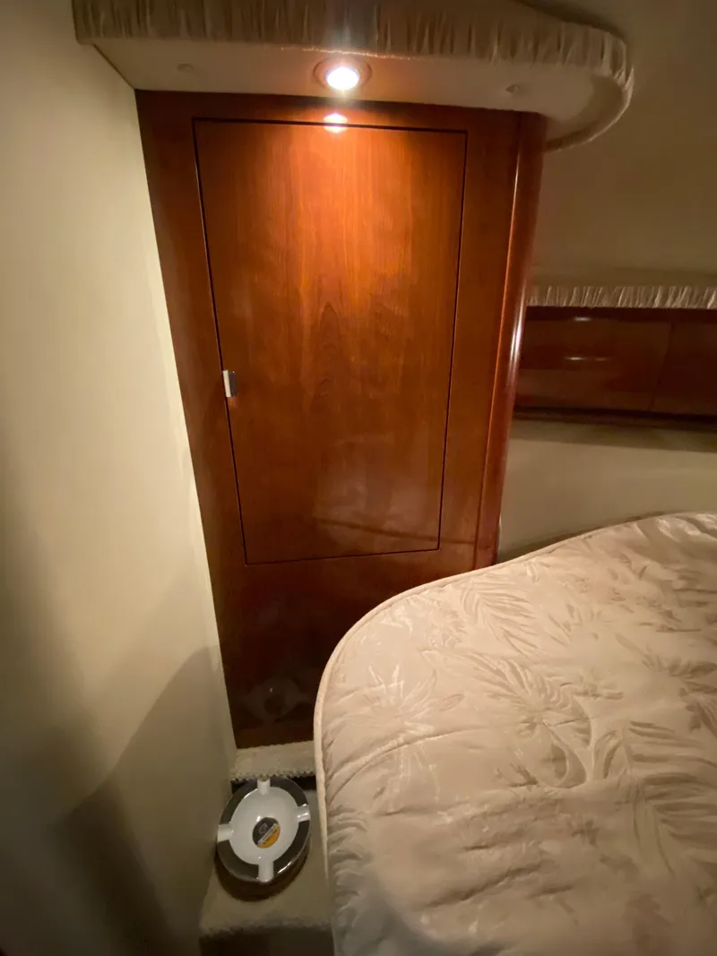Slide: The Image of Interior cabin of 2006 Sea Ray Sundancer 44 yacht with wooden closet and bed. - 24