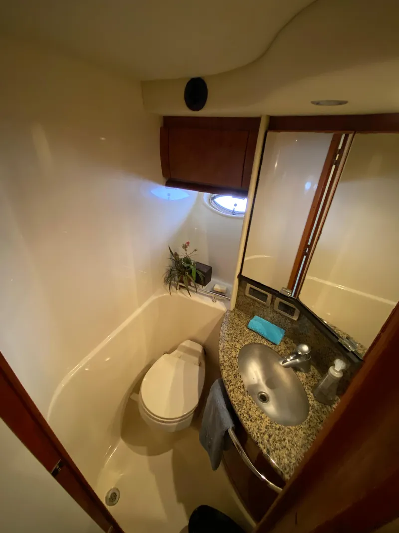Slide: The Image of 2006 Sea Ray Sundancer 44 yacht bathroom with granite countertop and modern fixtures. - 25