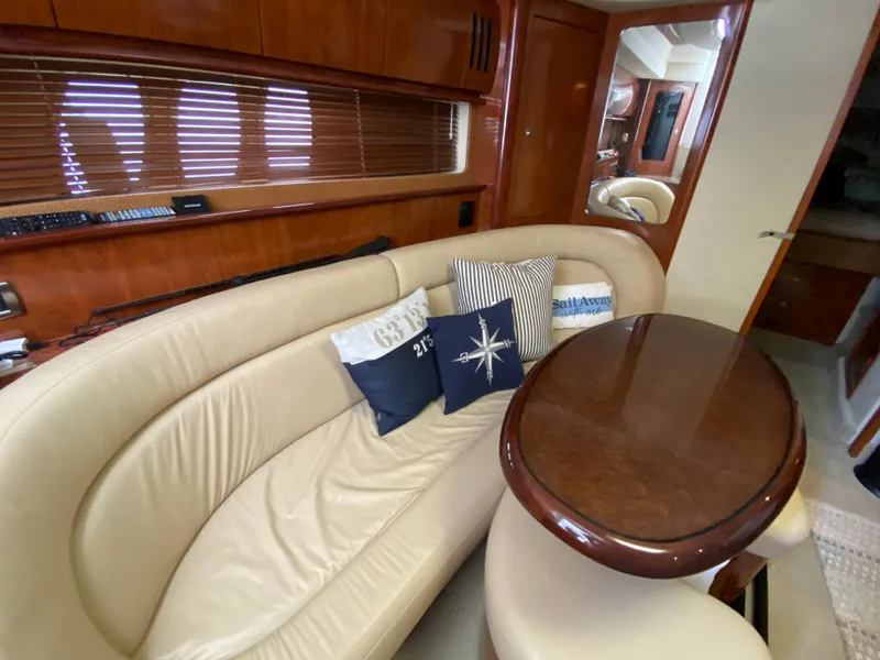 Slide: The Image of Luxurious 2006 Sea Ray Sundancer 44 interior with leather seating and decorative pillows. - 27