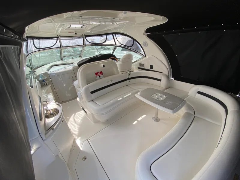 Slide: The Image of Interior of 2006 Sea Ray Sundancer 44 yacht with white seating and table. - 5