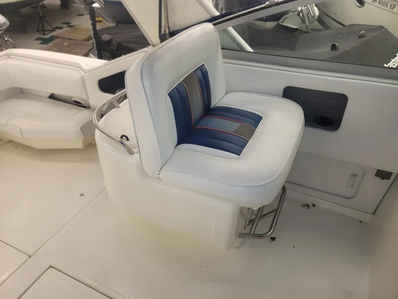 Slide: The Image of Interior seating of a 1992 Sea Ray 330 Sundancer boat. - 27
