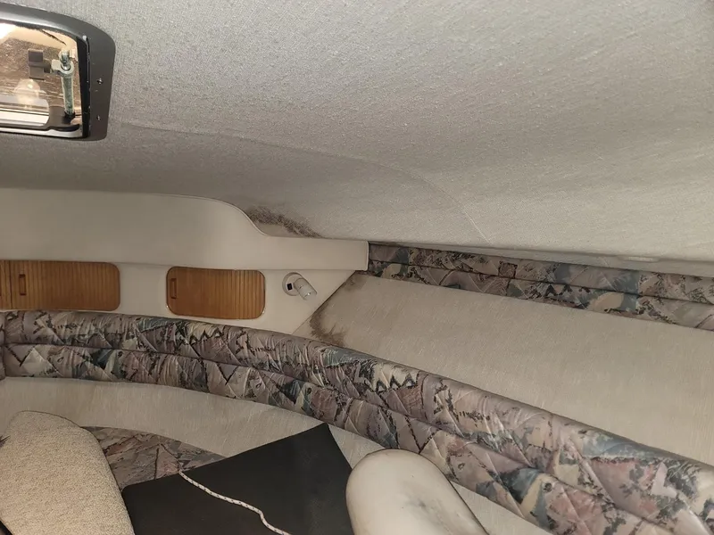 Slide: The Image of Interior cabin of a 1992 Sea Ray 330 Sundancer boat with patterned upholstery. - 38