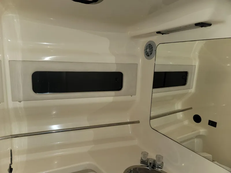 Slide: The Image of Interior of 1992 Sea Ray 330 Sundancer boat with window and mirror. - 43