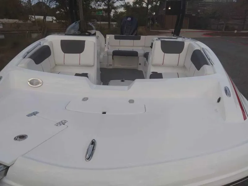 Slide: The Image of 2023 Tahoe 1950 boat interior with white and gray seating. - 10