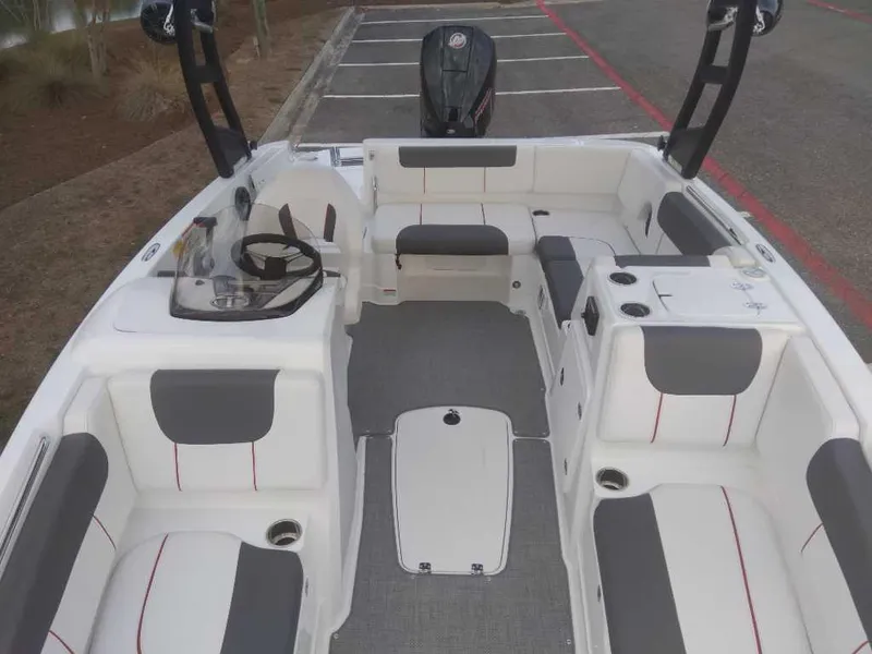 Slide: The Image of 2023 Tahoe 1950 boat interior with seating and steering wheel. - 12