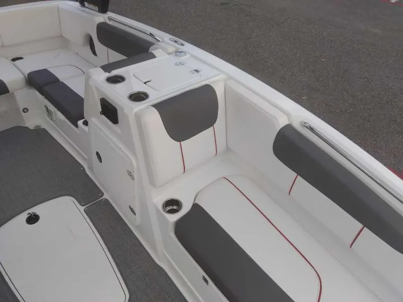 Slide: The Image of 2023 Tahoe 1950 boat interior with white and gray seating. - 13
