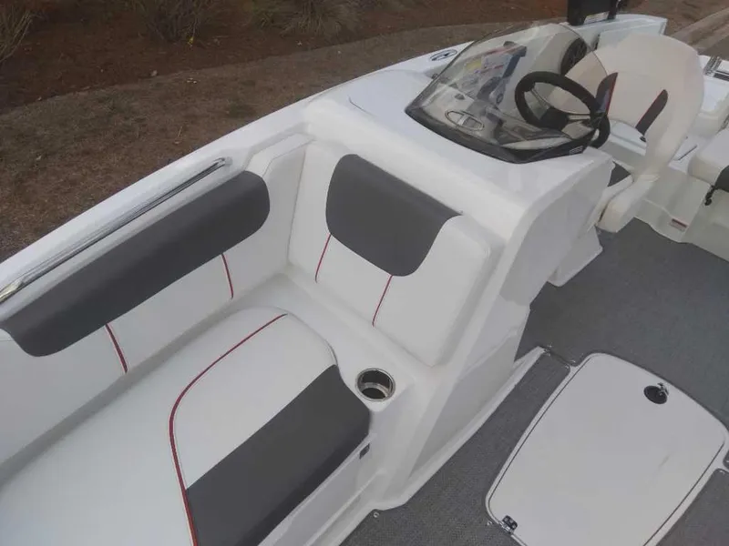 Slide: The Image of 2023 Tahoe 1950 boat interior with white and gray seating. - 14