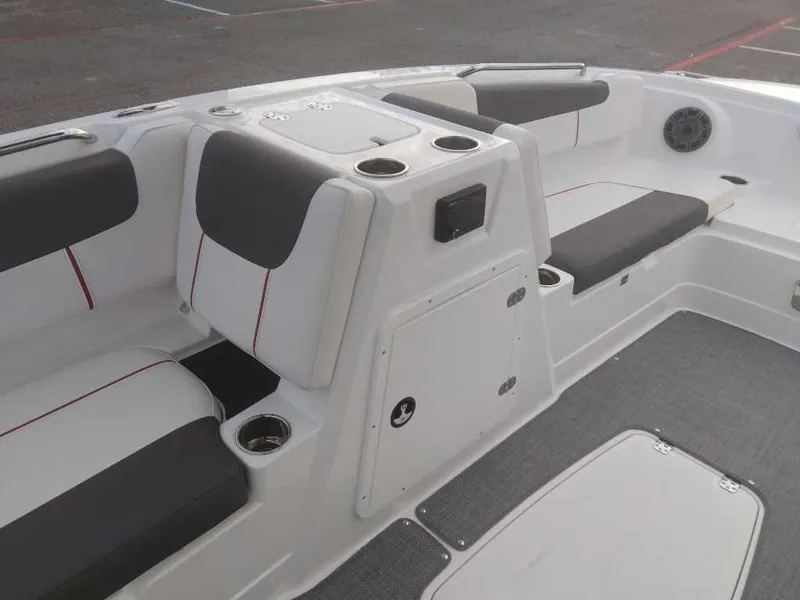 Slide: The Image of Interior seating of a 2023 Tahoe 1950 boat with cup holders and storage compartments. - 16