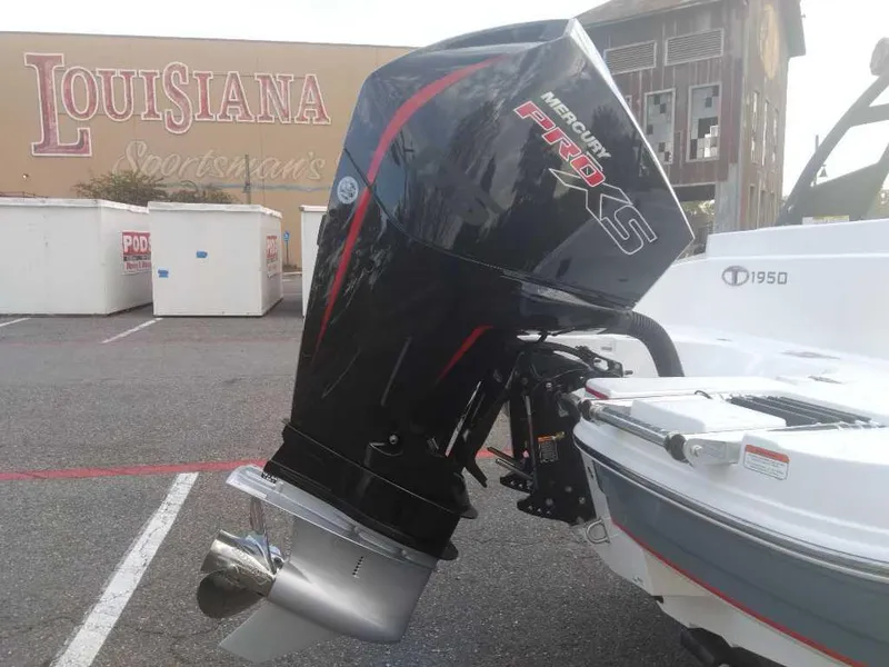 Slide: The Image of Tahoe 1950 boat with Mercury Pro XS engine, parked near Louisiana Sportsman's building. - 6