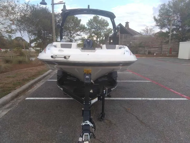 Slide: The Image of Tahoe 1950 boat, 2023 model, parked in an outdoor lot. - 9